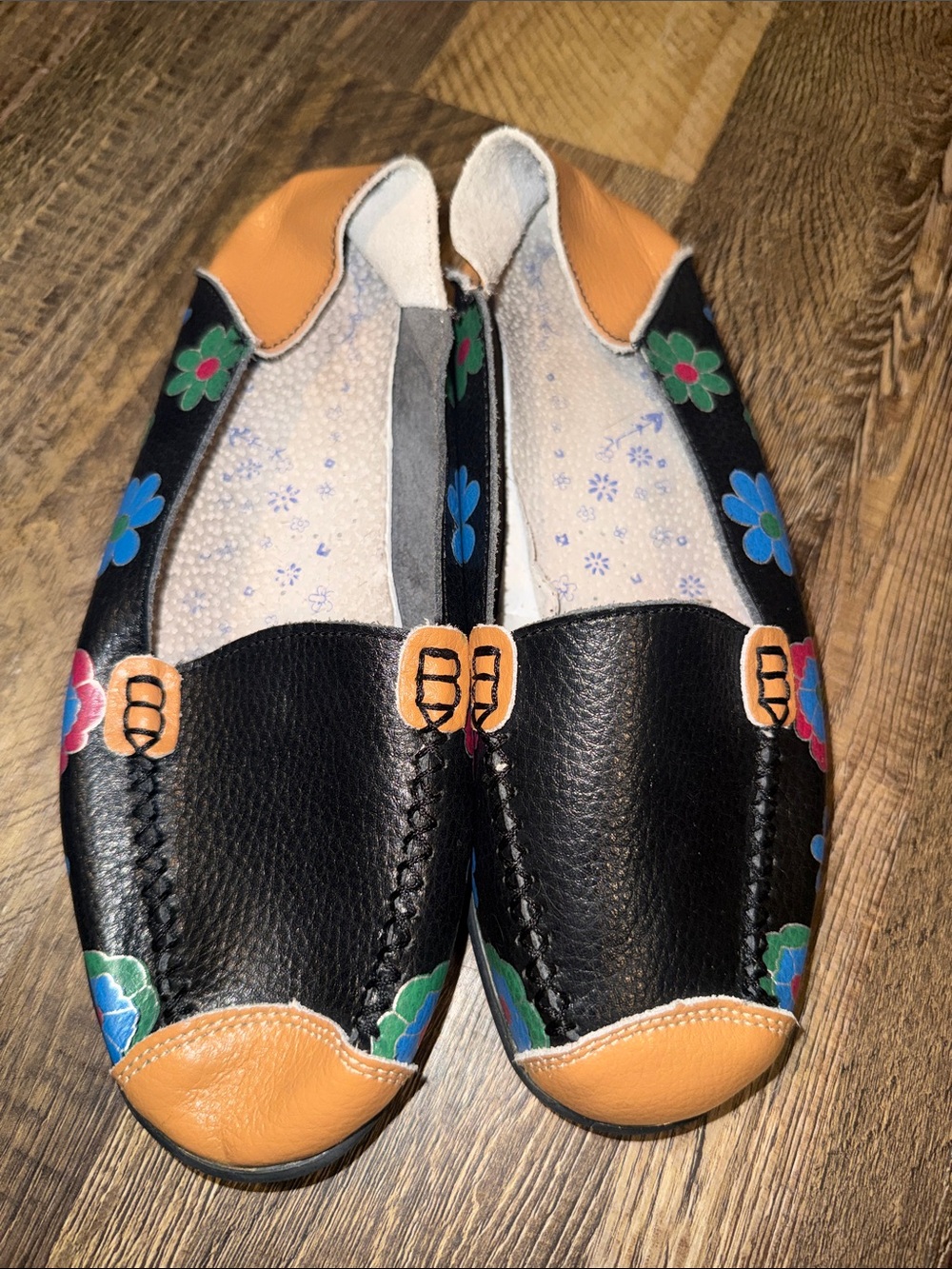 Black Leather Floral Slip-On Flats with Tan Accents